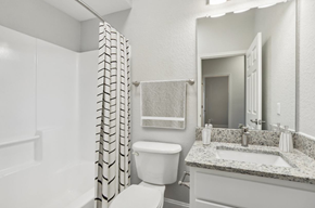 Lakeland apartment for rent - A bathroom with a toilet, sink, and shower.